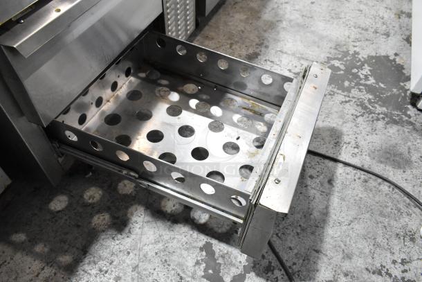 Continental stainless steel 2-drawer chef base on casters, 115 volts, 1 phase. Perforated interior, commercial use.