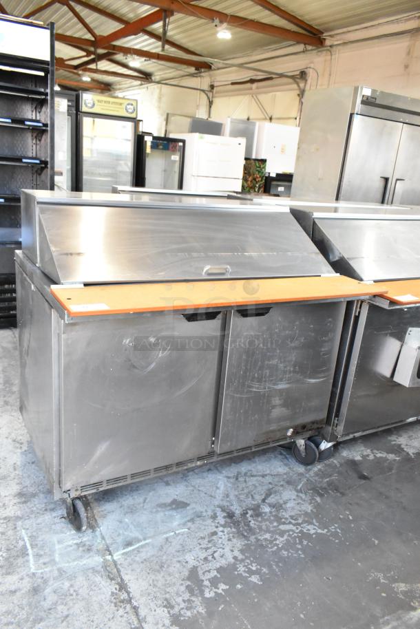 Beverage Air SPE48-18M stainless steel commercial prep table with casters. Used condition, 115 Volts, 1 Phase power.