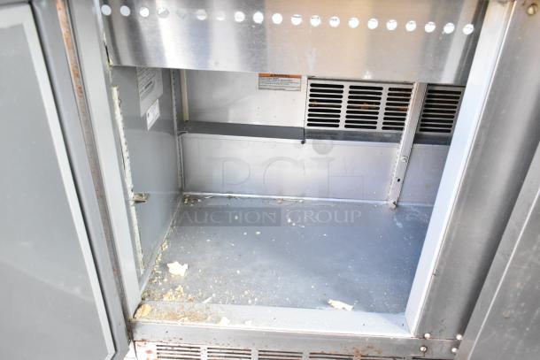 Beverage Air SPE48-18M stainless steel prep table with interior storage, 115V, on commercial casters, moderate wear.