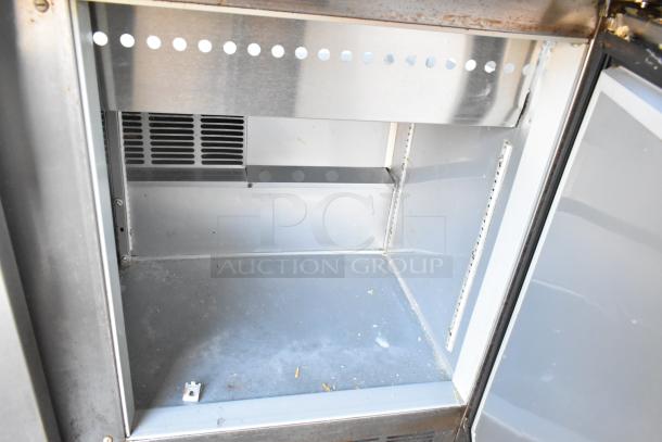 Beverage Air SPE48-18M stainless steel sandwich prep table interior, showing clean, durable compartment for food storage.