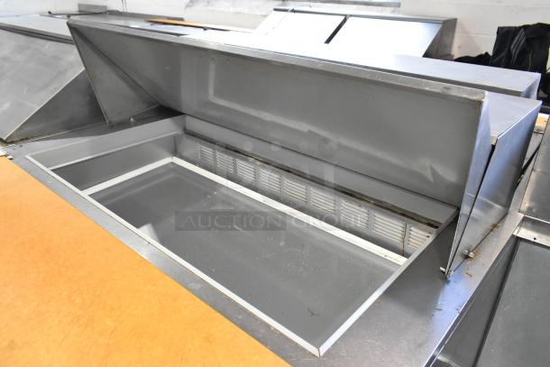 Beverage Air SPE48-18M stainless steel sandwich prep table with open lid, commercial casters, 115V, visible interior.