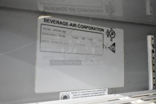 Beverage Air SPE48-18M label on stainless steel commercial sandwich salad prep table showing model and specifications.
