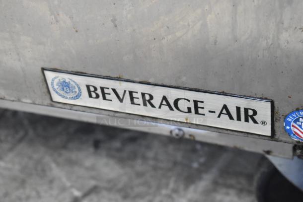 Beverage Air SPE48-18M stainless steel prep table with label, on commercial casters. 115V, 1 Phase, visible wear.