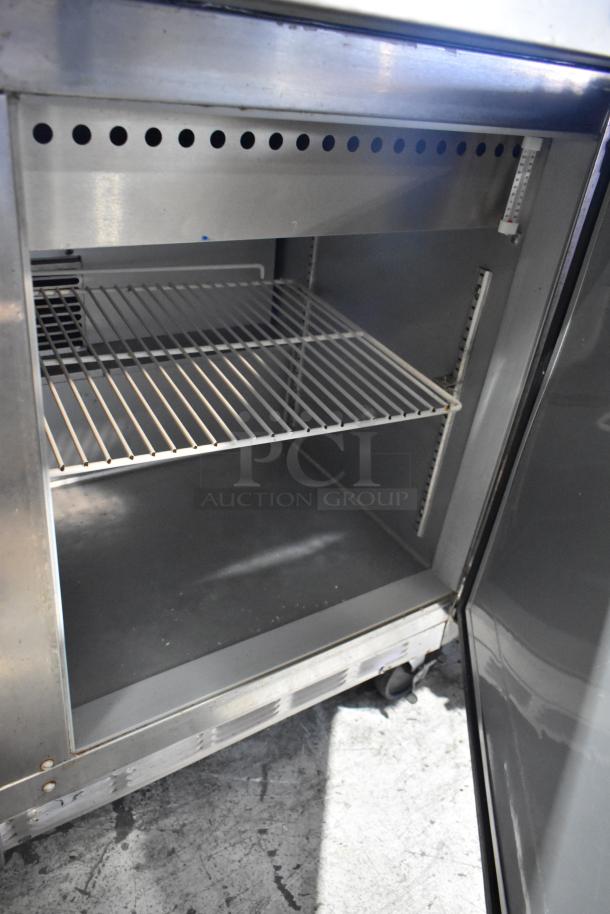 Beverage Air SPE48-18M stainless steel prep table, open door view, shelves visible, on casters, 115 volts, 1 phase.