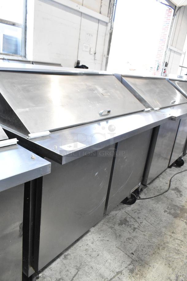 Beverage Air SPE48-18M stainless steel prep table on casters, 115V, 1 phase, commercial use, visible wear on surface.