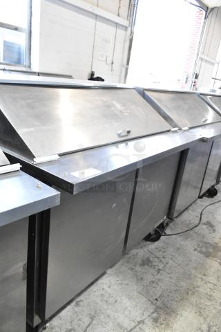 Beverage Air SPE48-18M stainless steel prep table on casters, 115V, 1 phase, commercial use, visible wear on surface.