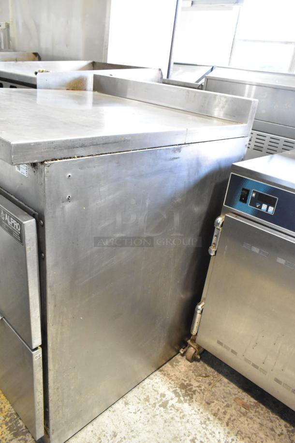 Randell stainless steel commercial 2-drawer work top cooler, 115 volts, 1 phase. Visible wear, durable for kitchen use.