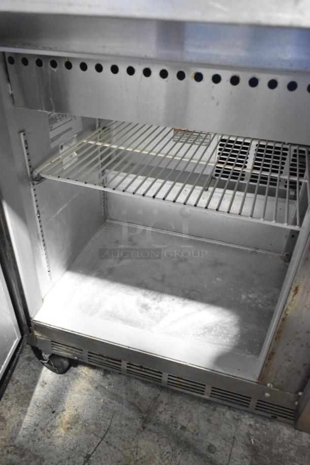 Beverage Air SPE48-18M stainless steel prep table, bain marie style, on casters. Interior shelf visible, in used condition.