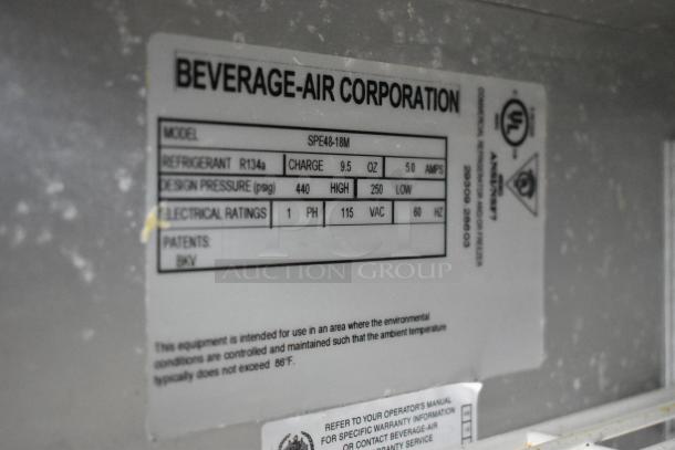 Beverage Air SPE48-18M label showing specifications: refrigerant R134a, charge 9.5 oz, 115V, 5A, 1 phase.
