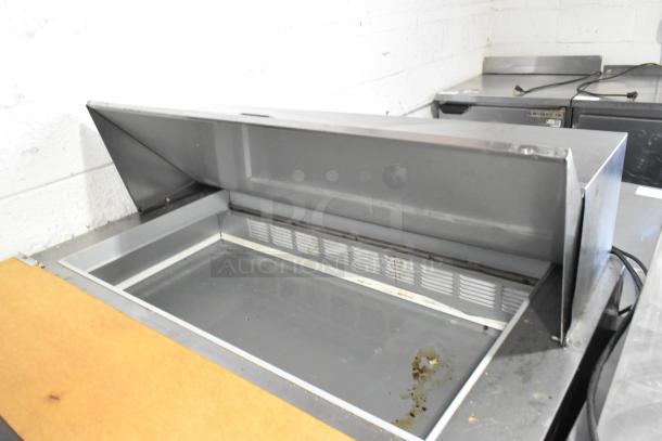 Beverage Air SPE48-18M stainless steel prep table with commercial casters, 115V, 1 phase, used condition.