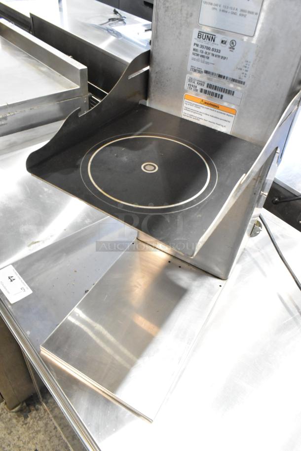 Bunn ITCB-DV stainless steel commercial iced tea machine with hot water dispenser, features controls and labels visible.