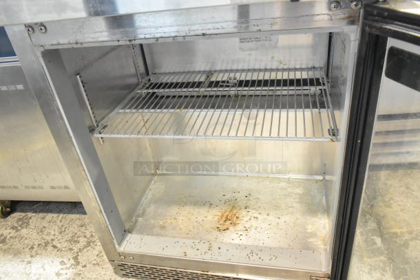 2019 Continental SW27NGD stainless steel commercial cooler, single door, visible wear, wire shelf, 115 volts, 1 phase.