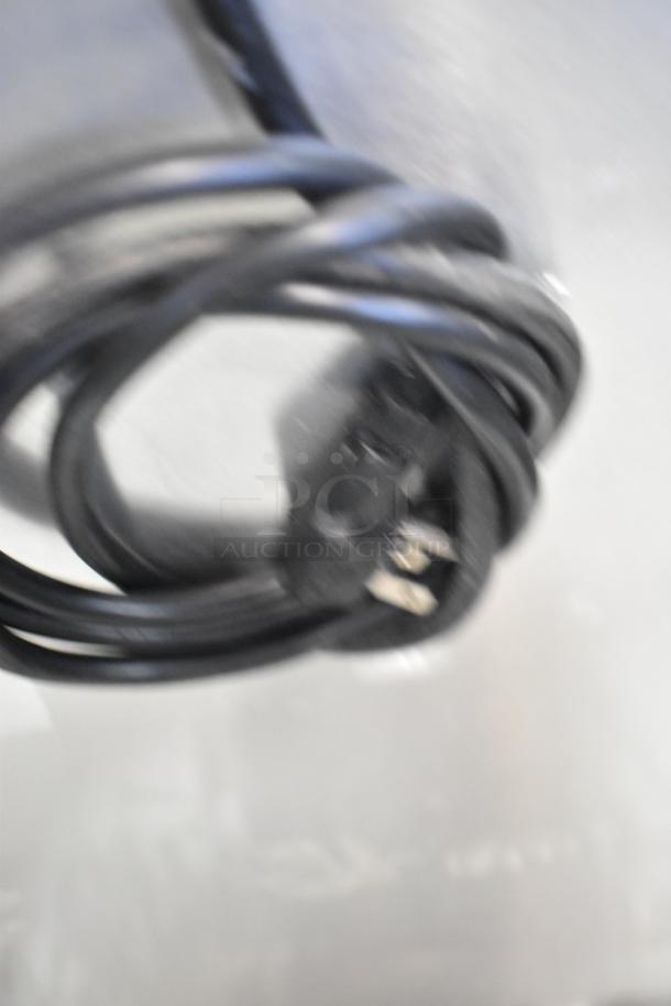 Coiled black power cord for 2019 Continental SW27NGD undercounter cooler, 115 volts, 1 phase, stainless steel finish.