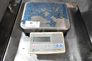 AND FG-30KBM countertop food scale, 60 lb capacity, visible wear on platform, digital display, condition used.