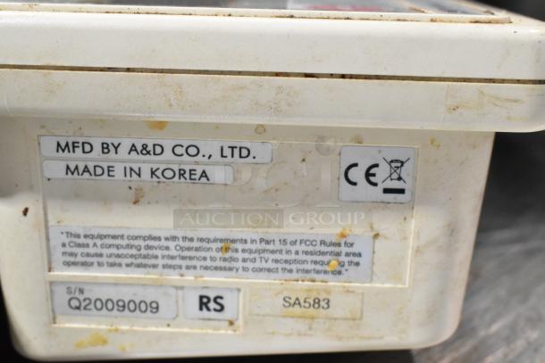 AND FG-30KBM food scale, 60 lb capacity, countertop model. Shows markings: "MFD by A&D Co., Ltd." and "Made in Korea." Used.