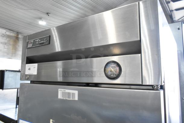 2017 True T-19F stainless steel commercial freezer, single door, poly coated racks, analog temperature gauge, excellent condition.