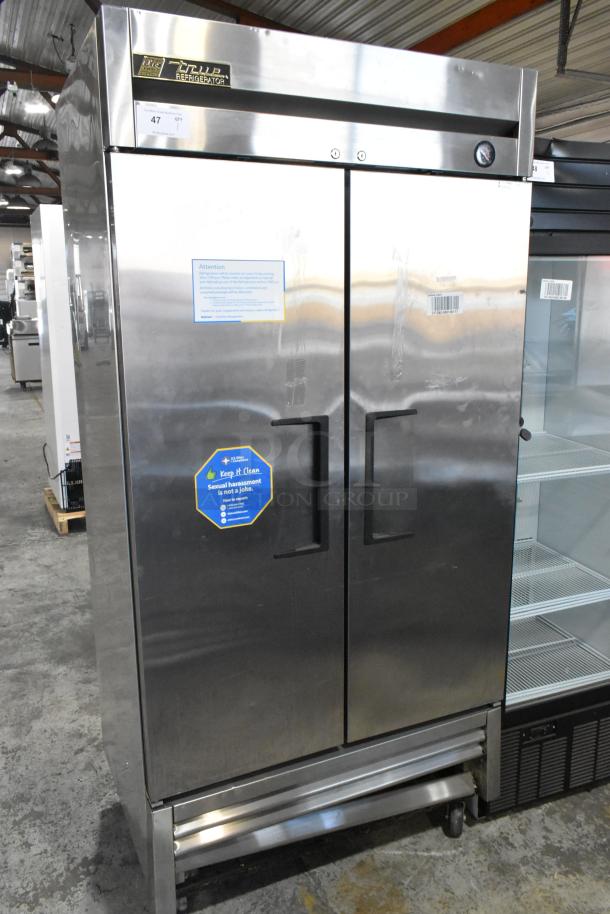 2016 True T-35 stainless steel commercial 2-door reach-in cooler with poly-coated racks on commercial casters, model T-35.