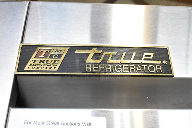 2016 True T-35 stainless steel cooler, poly-coated racks, on casters. Model label showing "True Refrigerator" logo.