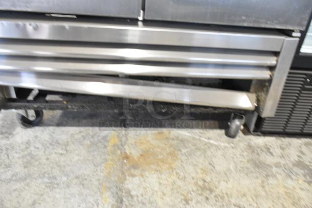 2016 True T-35 stainless steel 2-door cooler with poly-coated racks, on commercial casters. 115V, 1 phase. Visible wear.