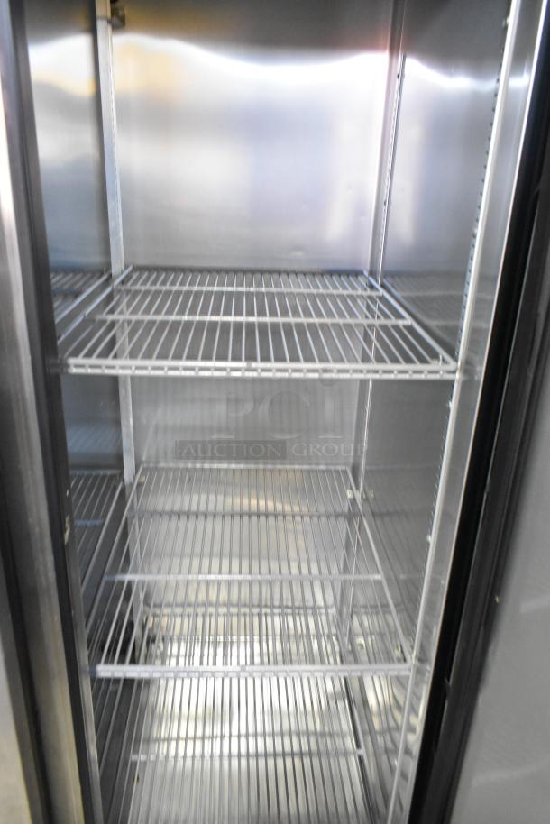 2016 True T-35 stainless steel 2-door reach-in cooler with poly-coated racks and commercial casters, 115V, 1-phase.