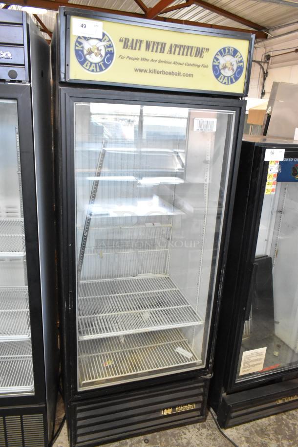True GDM-26F-LD commercial freezer with a single glass door and poly-coated racks. 115 volts, 1 phase. "Bait with Attitude" sign.