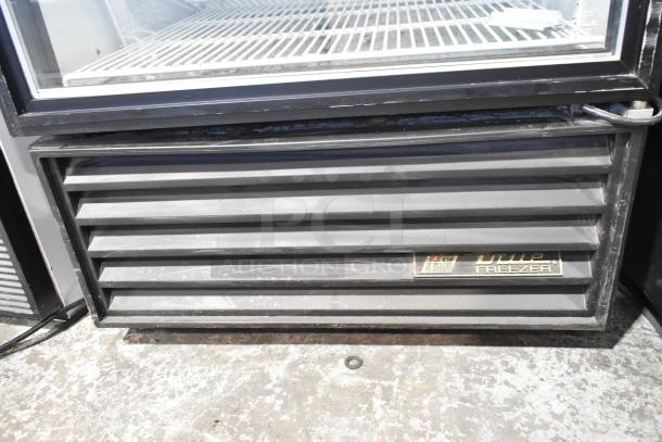 True GDM-26F-LD single-door reach-in freezer. Features poly-coated racks, visible brand label, and louvered panel.