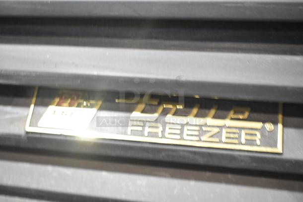 True GDM-26F-LD freezer logo on black surface, showing brand and model details.