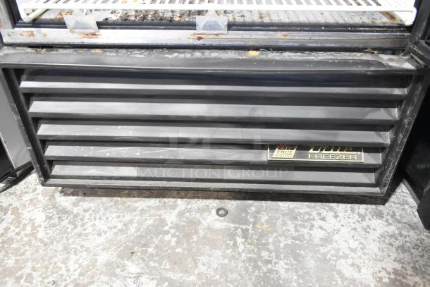 True GDM-26F-LD freezer base with visible vents and branding, metal structure with minor wear. 115 Volts, 1 Phase.
