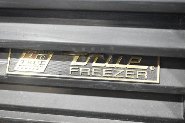 True GDM-26F-LD freezer label showcasing brand and model name. In used condition.