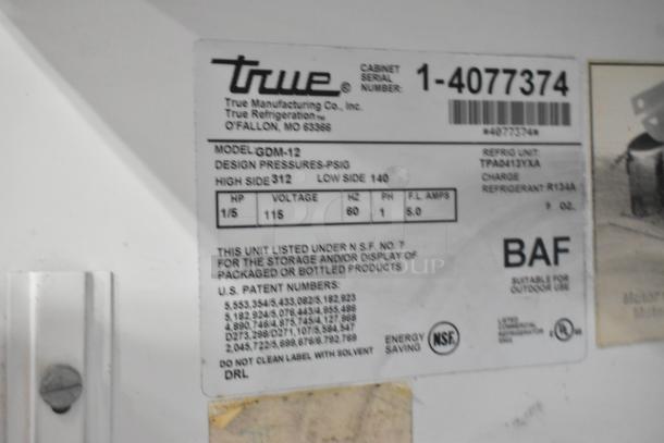 True GDM-12 Cooler label showing model, 115V, single phase, refrigerant details, and NSF certification.