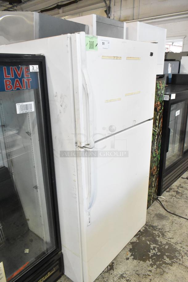 Maytag M1TXEGMYW01 metal reach-in cooler with freezer, 115 volts, 1 phase; white exterior with visible wear and auction tag.