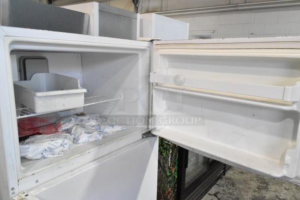 Maytag M1TXEGMYW01 metal reach-in cooler with freezer, 115 volts, 1 phase, open door view showing interior shelves.