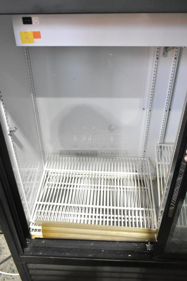 2019 True GDM-41SL-48-HC-LD cooler, 2-door, metal, poly-coated racks, 115V, 1 phase, well-maintained, clean interior.