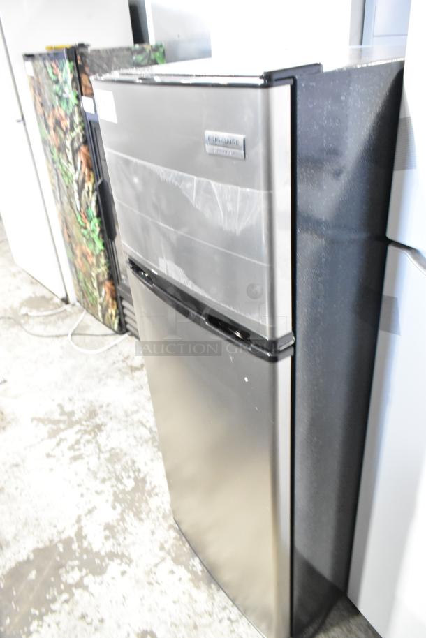 Frigidaire Gallery FGFR727-6COM stainless steel cooler with freezer, 115 volts, 1 phase, label on front.