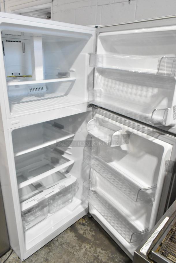 LG LTCS20020W/05 reach-in cooler with freezer. 115V, 1 Phase. Features multiple shelves and door compartments.