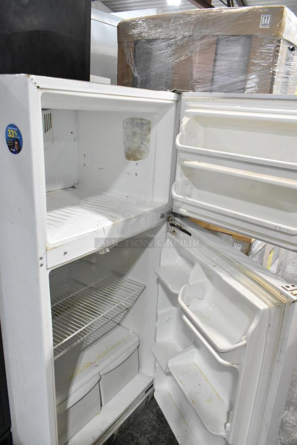 Electrolux FRT15B3AW9 reach-in cooler with freezer. Slight wear visible, 115V, 1 phase. Interior shelves and door compartments shown.