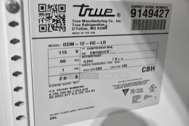 Label of 2017 True GDM-12-HC-LD cooler indicating model, voltage, refrigerant, and serial number. Made in USA.