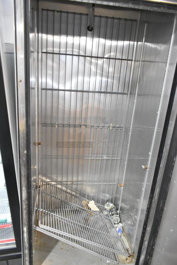 2017 True T-19F stainless steel commercial freezer, single door, with poly-coated racks, 115V, 1 phase; two casters need attaching.