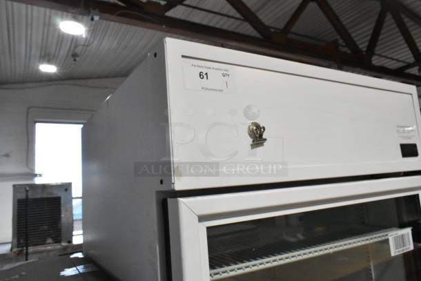 2021 True TSCI-600R-G-PH single door cooler, metal, poly-coated racks, 115V, 1 phase, commercial use, auction tag "61".