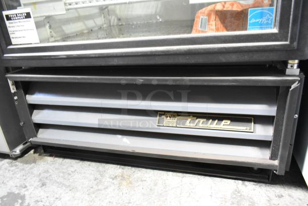 True GDM-12 commercial cooler, metal frame, single door, poly coated racks, 115 volts, Energy Star label visible.