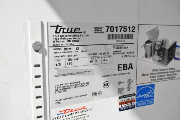True GDM-12 metal cooler merchandiser label showing model, 115 volts, 1 phase, Energy Star certified.