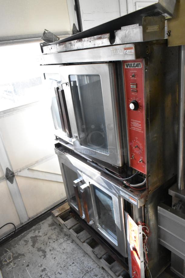 Vulcan VC4GD stainless steel commercial convection ovens, natural gas, view-through doors, metal racks, thermostatic controls.