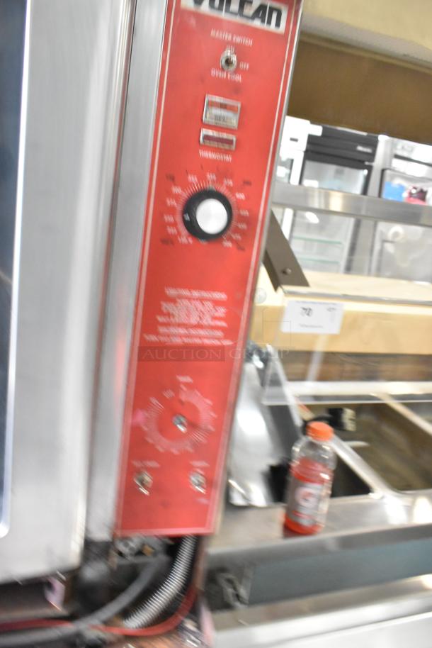 Vulcan VC4GD stainless steel commercial convection oven with view-through doors, metal racks, and thermostatic controls.