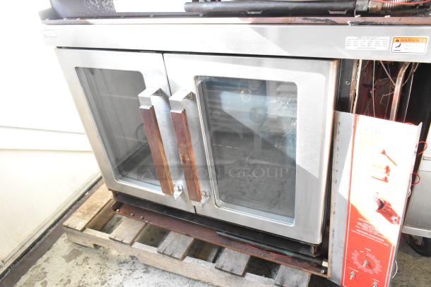 Vulcan VC4GD stainless steel convection oven with view-through doors, thermostatic controls, and metal racks.