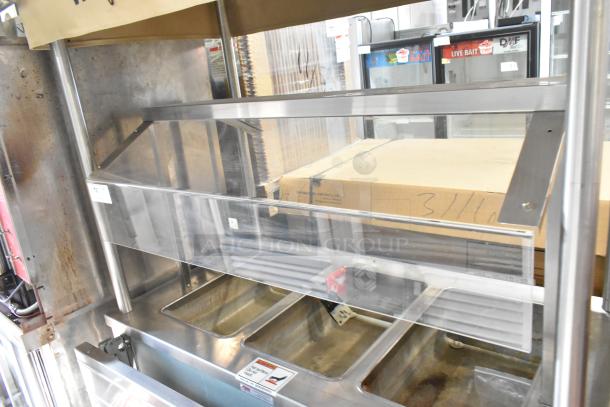 Piper Products 730301 stainless steel 3-bay steam table with sneeze guard. Features tray slide and 208V, 1 phase electric power.