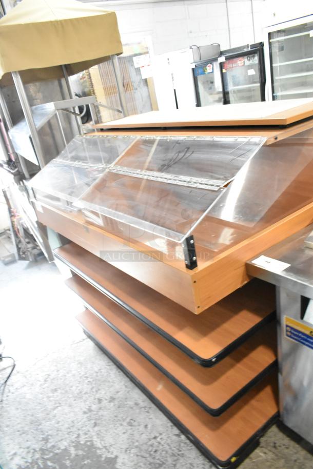 Wood pattern dry merchandiser with glass display case, wooden shelving, and metal frame, in used condition. Ideal for retail displays.