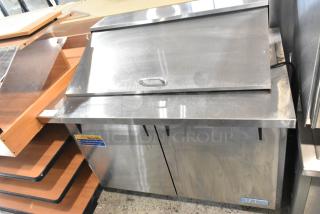 Turbo Air MST-48-18 stainless steel prep table with sliding lid and casters, model MST-48-18, for commercial use.