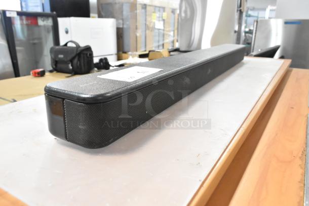 Sony HT-S100F Sound Bar, black, 120V, 1 Phase, in good condition. Spacious design with visible label indicating model.