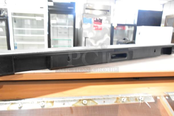 Sony HT-S100F Sound Bar, 120V, 1 Phase, black color, shown on a wooden surface, used condition.