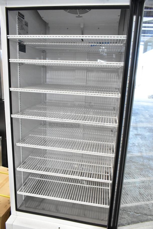 2021 True TSCI-600R-G-PH commercial single door cooler, glass front, metal body, poly-coated racks, excellent condition.